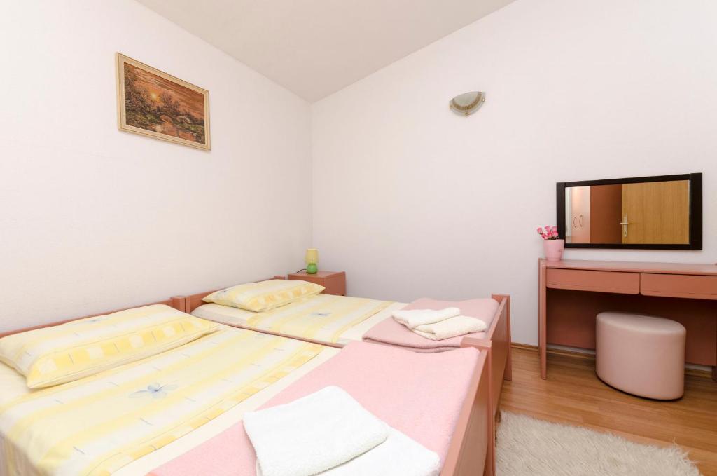 Posteľ alebo postele v izbe v ubytovaní Apartment Smiljana