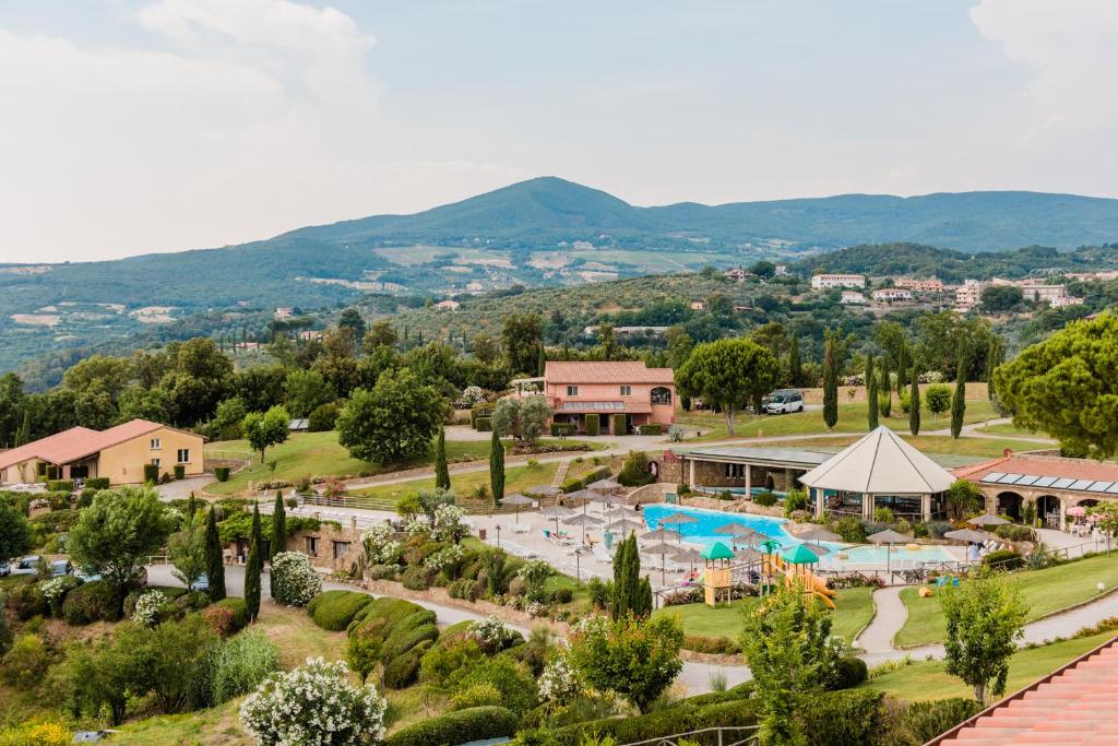 an aerial view of a resort with a swimming pool at Borgo Felciaione in Riparbella