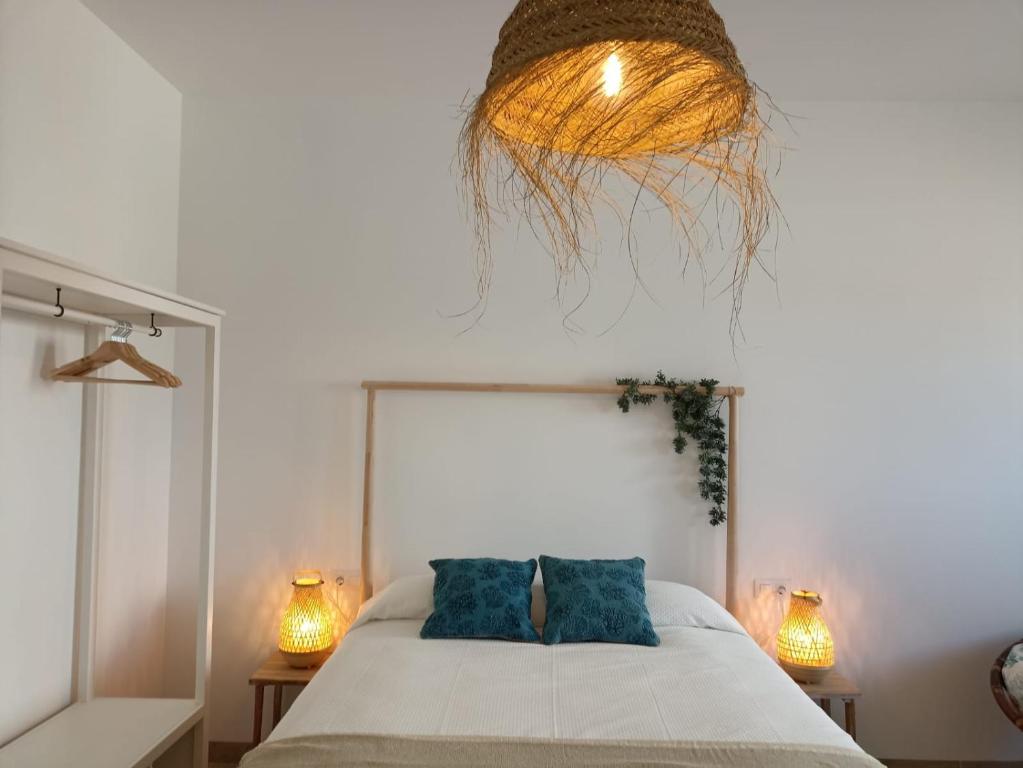 A bed or beds in a room at Mirador de Trafalgar Conil
