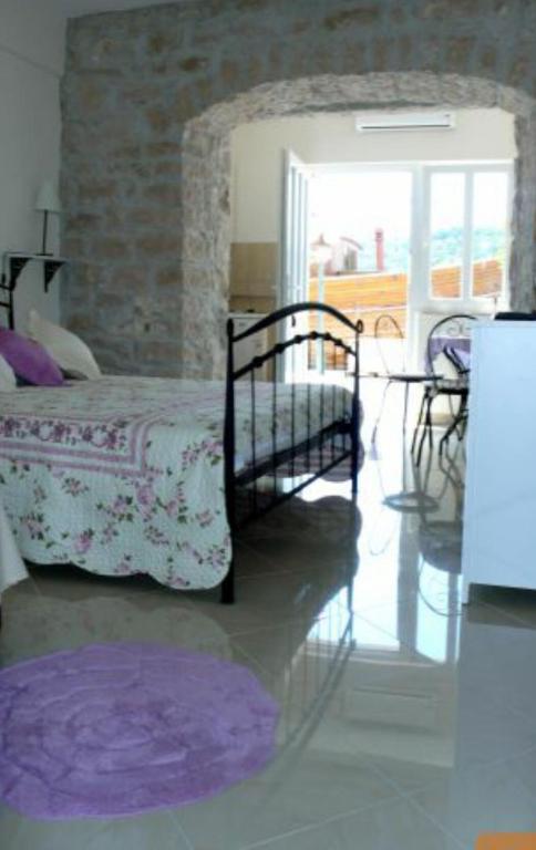 Postel nebo postele na pokoji v ubytování Apartments Djurdjica