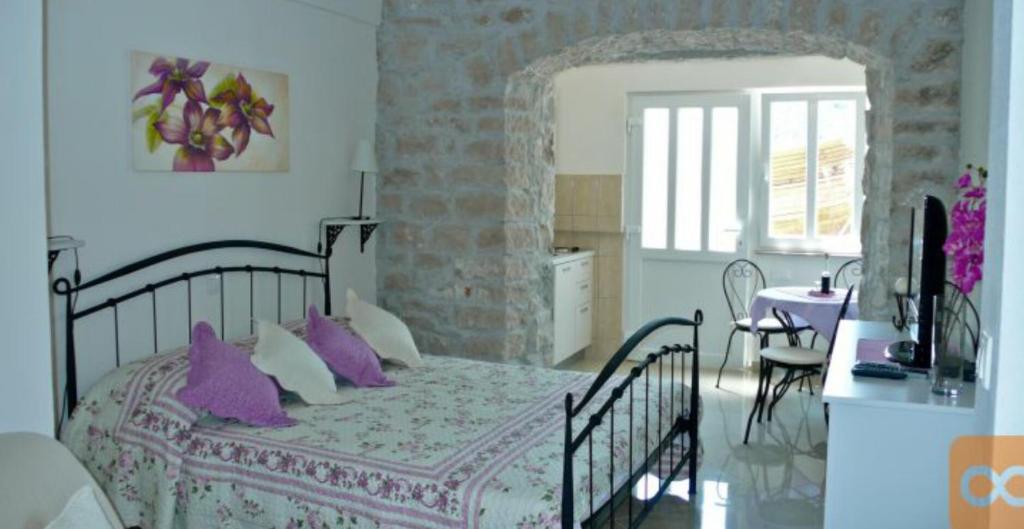 Postel nebo postele na pokoji v ubytování Apartments Djurdjica