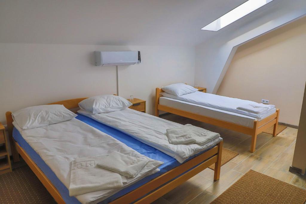 Postel nebo postele na pokoji v ubytování Konak kod Hame