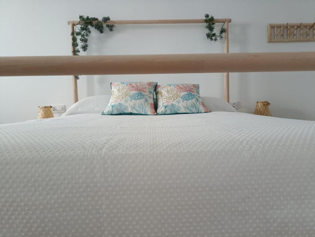 A bed or beds in a room at Mirador de Trafalgar Conil
