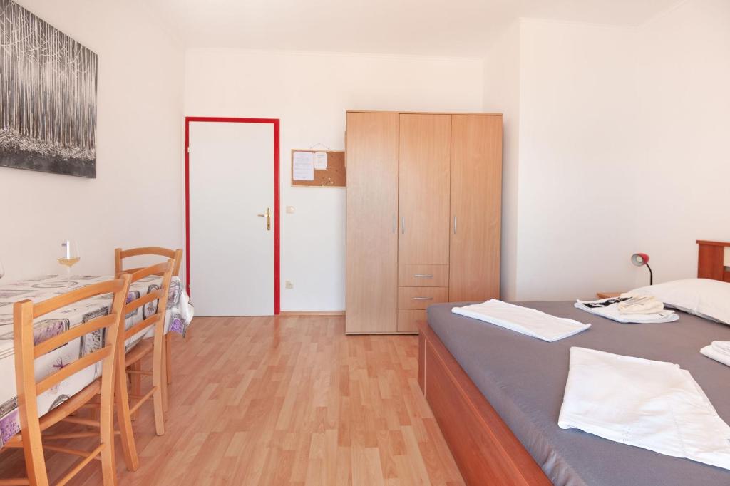 Posteľ alebo postele v izbe v ubytovaní Apartments Tomic