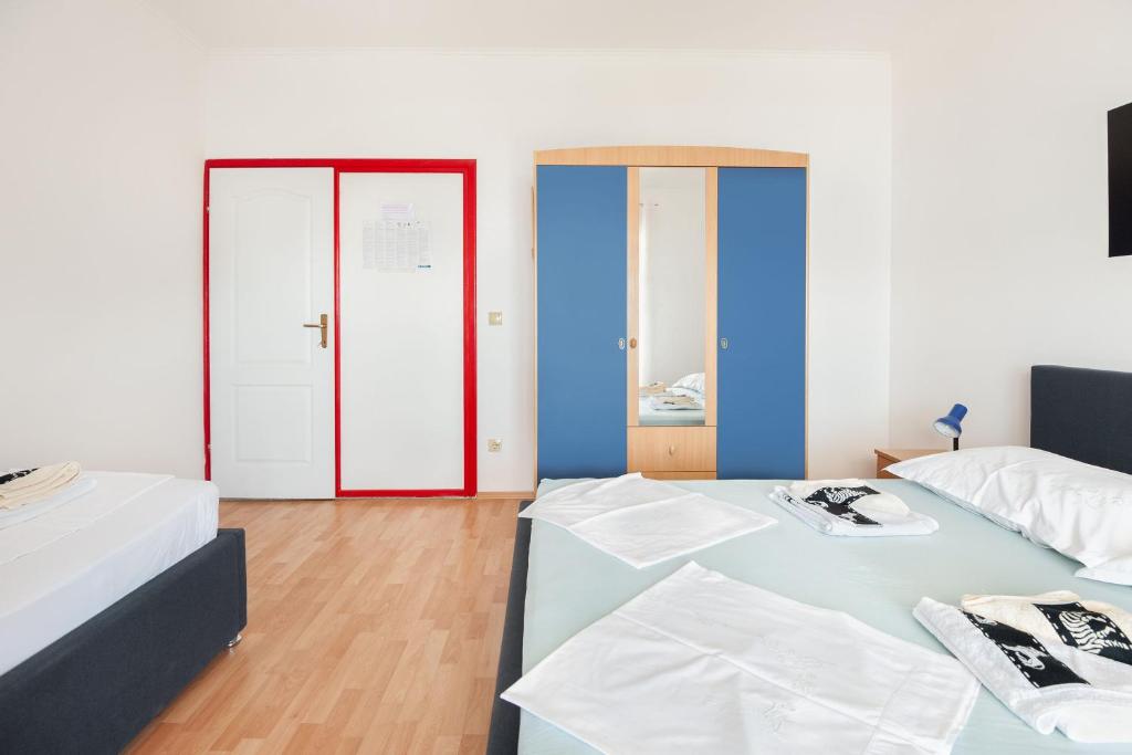 Posteľ alebo postele v izbe v ubytovaní Apartments Tomic