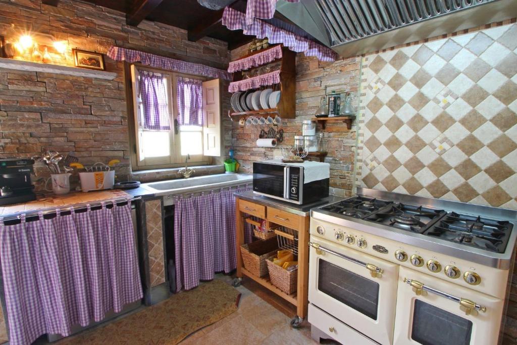 Kuchyň nebo kuchyňský kout v ubytování IL PICCOLO PARADISO