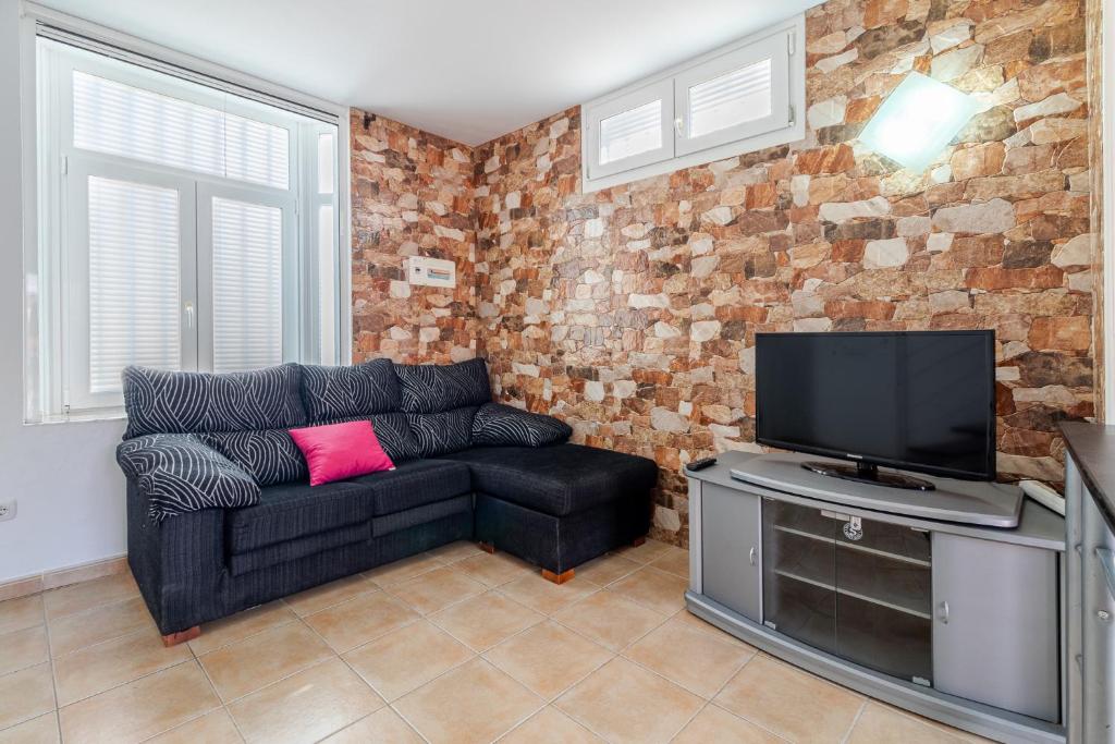 A television and/or entertainment centre at Flatguest Costa Golf II