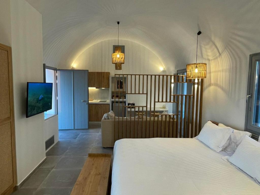 Postel nebo postele na pokoji v ubytování Anemi Vine Villas