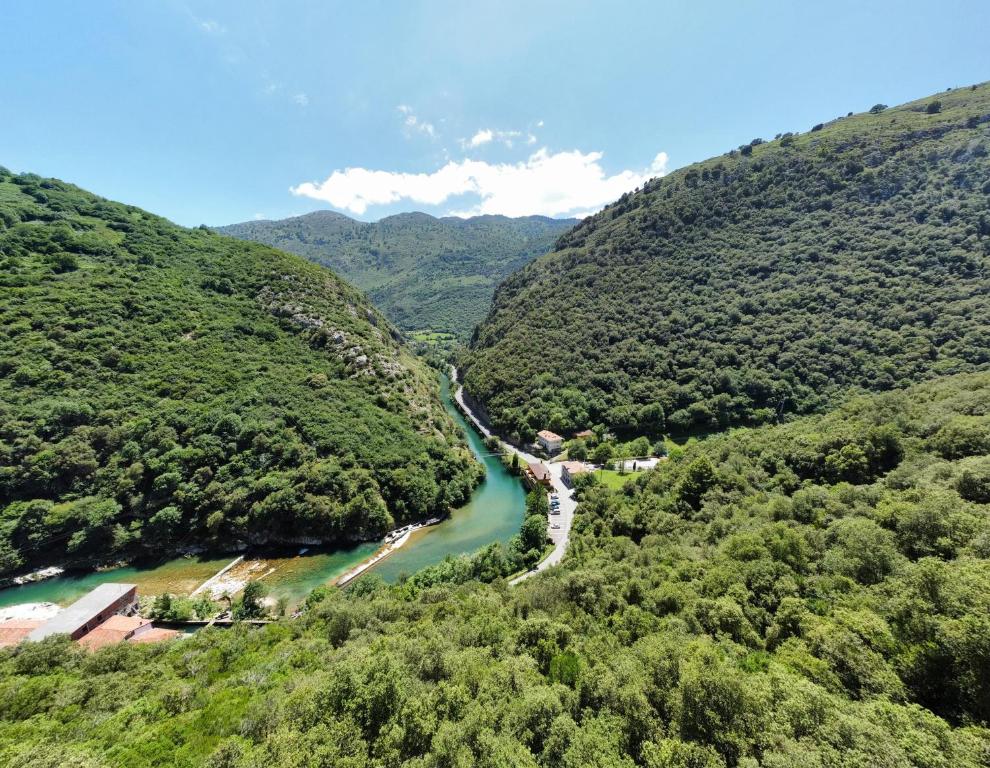 an aerial view of a river in a valley at Las Dos Peñas in Mier