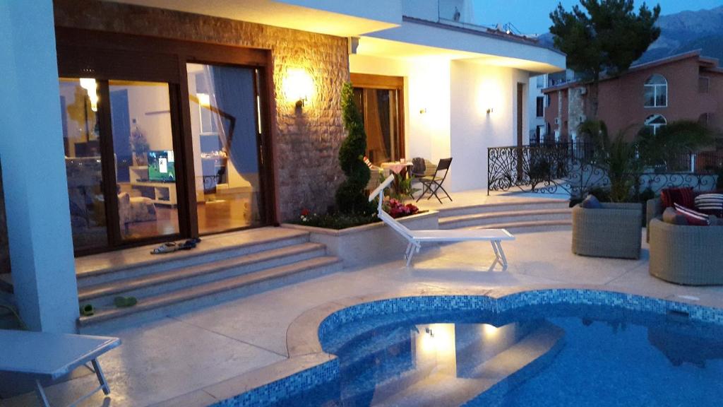 a house with a swimming pool on a patio at Villa Perla with Sea View in Bar
