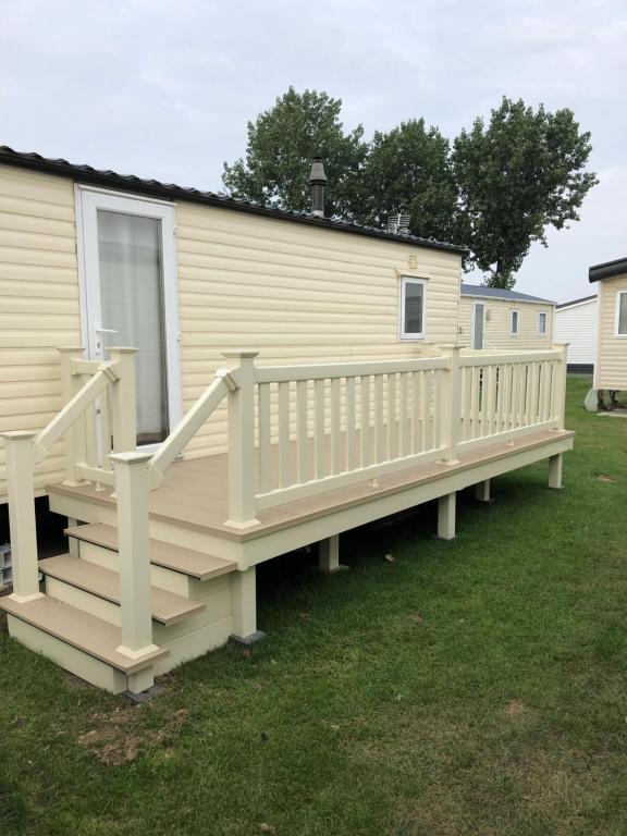 a large deck on a mobile home at 8 Berth Caravan in Clacton-on-Sea