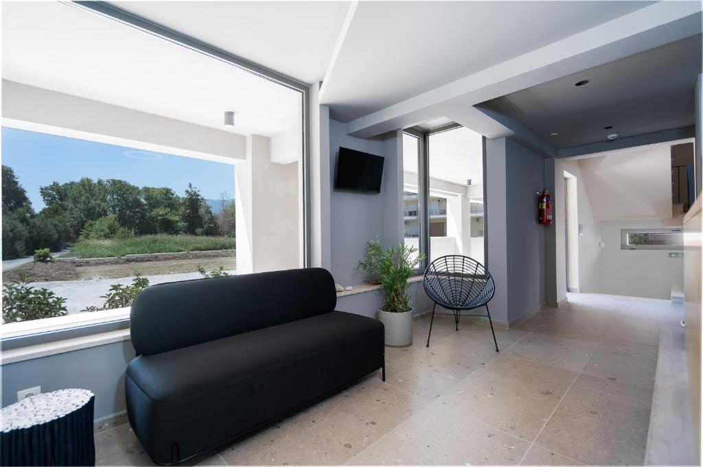Telewizja i/lub zestaw kina domowego w obiekcie Funtuki Seaside Apartments