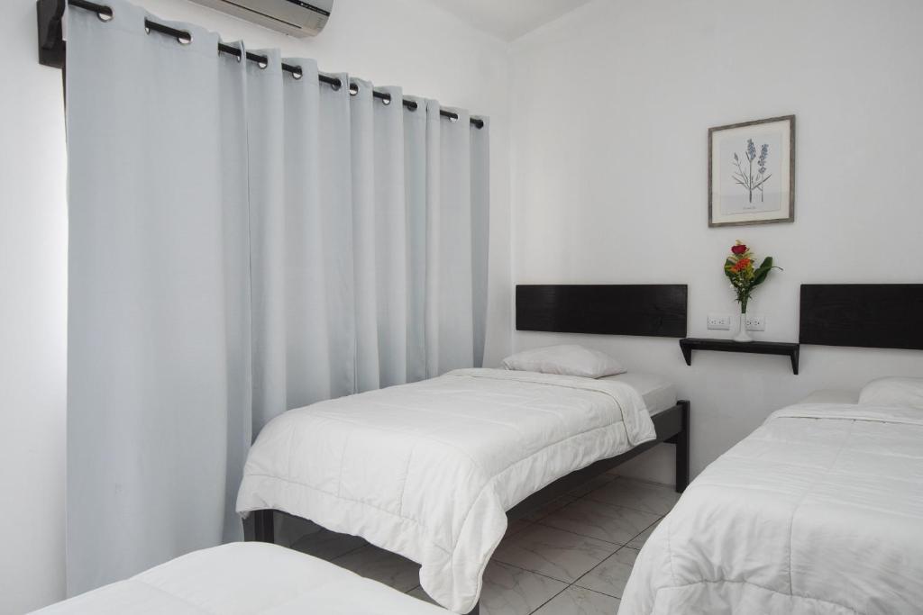 Postel nebo postele na pokoji v ubytování Hotel Cañas