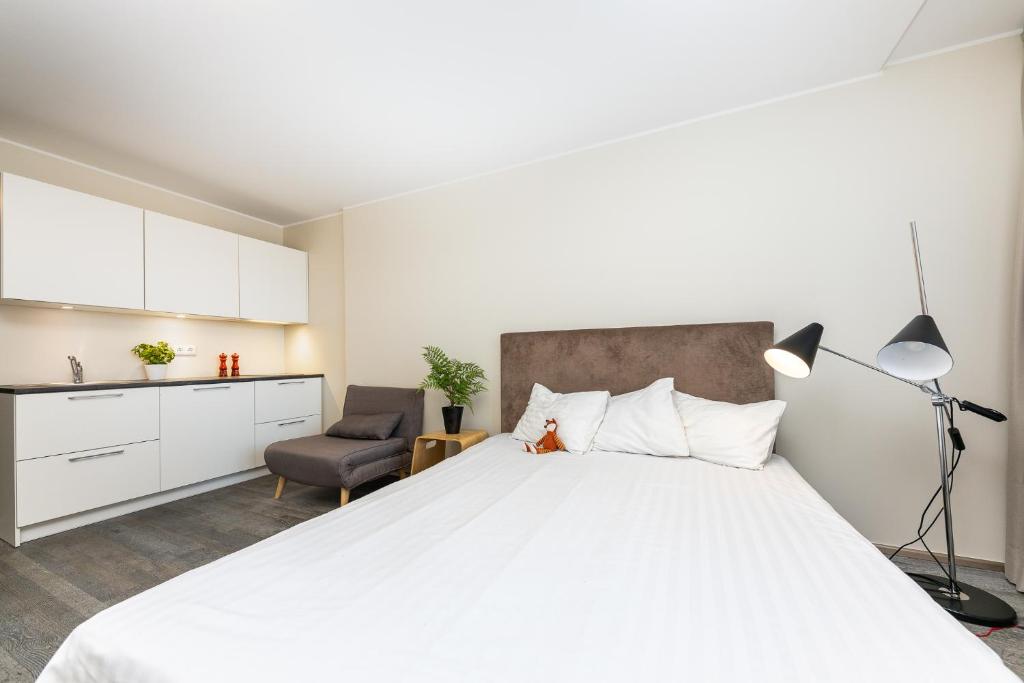 Postel nebo postele na pokoji v ubytování Aisa 39 Apartments