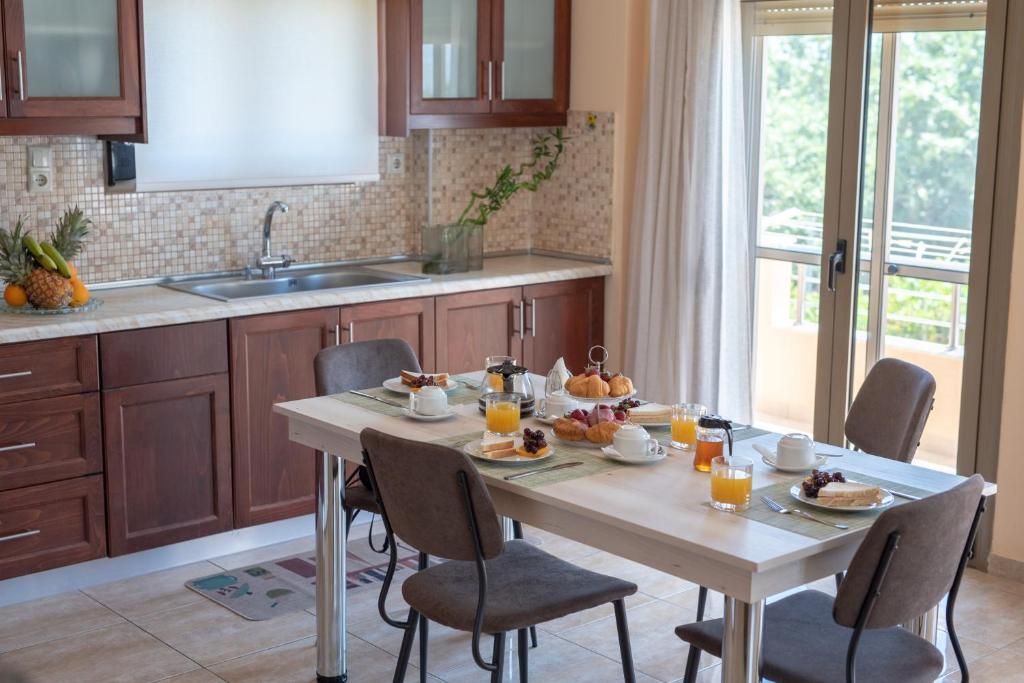 a kitchen with a table with food on it at Libyan Sea Luxury Apartment 1 in Ierapetra