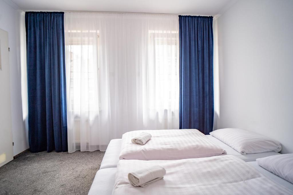 Posteľ alebo postele v izbe v ubytovaní Hotelik Maria