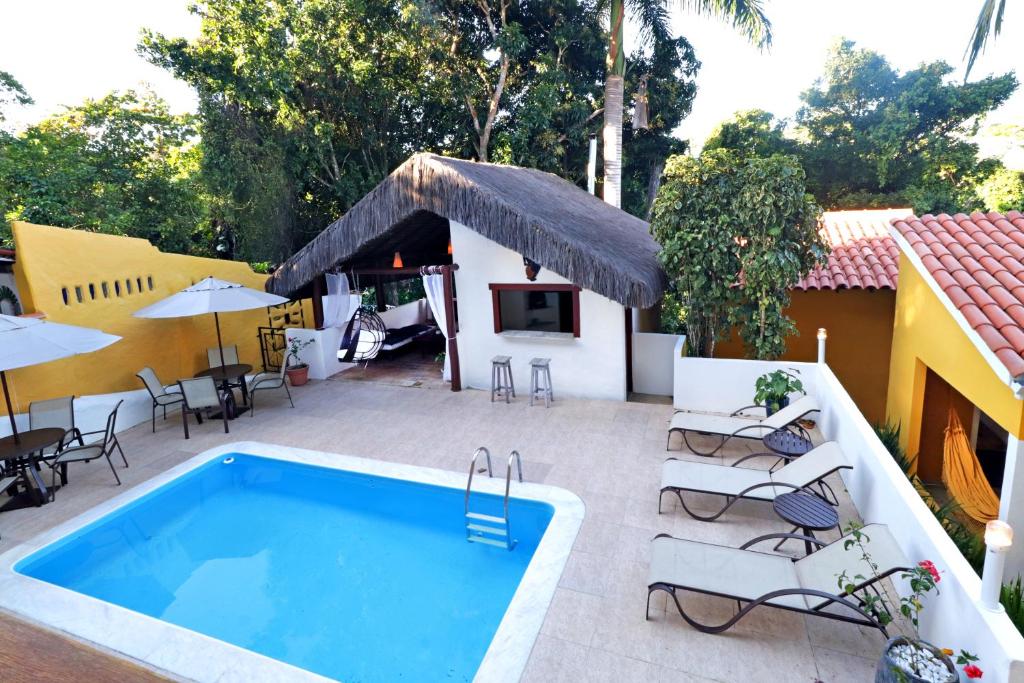 Bazén v ubytování Pousada Arraial Colonial, Localizada no Centrinho e de Fácil Acesso a Praia e a Rua Mucugê nebo v jeho okolí