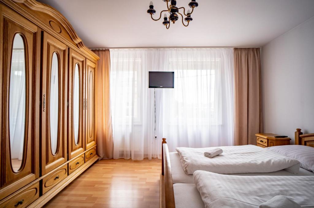 Posteľ alebo postele v izbe v ubytovaní Hotelik Maria