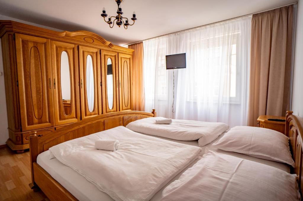Posteľ alebo postele v izbe v ubytovaní Hotelik Maria
