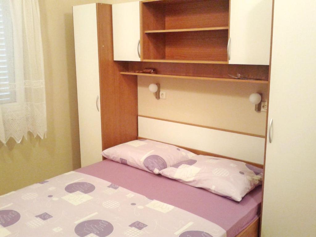 Postel nebo postele na pokoji v ubytování Apartments Mira
