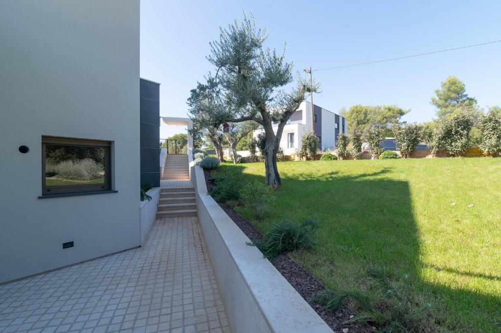Vonkajšia záhrada v ubytovaní luxury Villa One Way