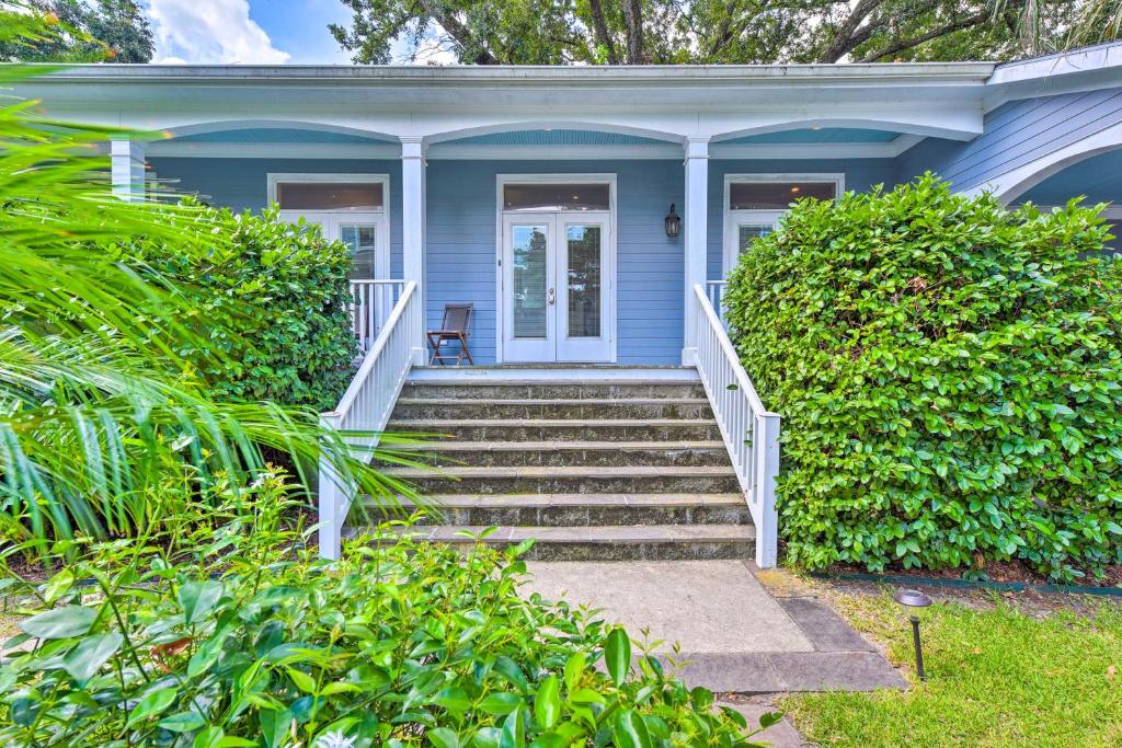 a blue house with stairs leading to the front door at Adorable New Orleans Home about 6 Mi to Uptown! in New Orleans