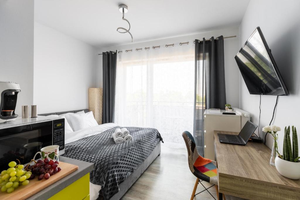 Televízia a/alebo spoločenská miestnosť v ubytovaní P&O Serviced Apartments - Dionizosa