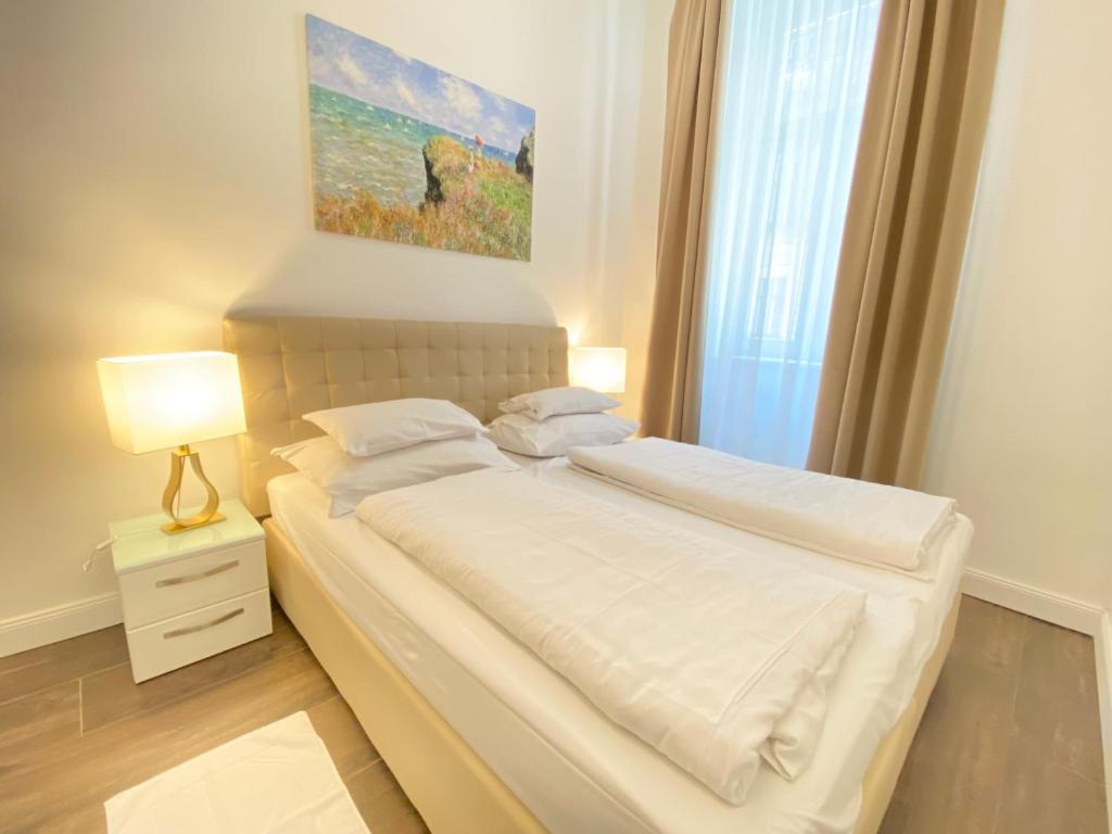 Posteľ alebo postele v izbe v ubytovaní Steiner Residences Vienna Taborstrasse