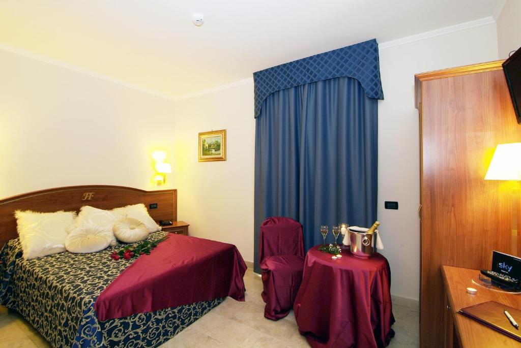 Postel nebo postele na pokoji v ubytování Fashion Hotel
