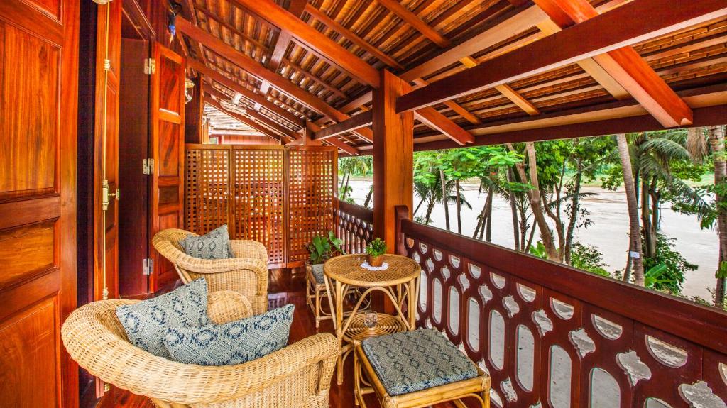 Luxury wood sitting lounge inside the junior suite looking towards the river