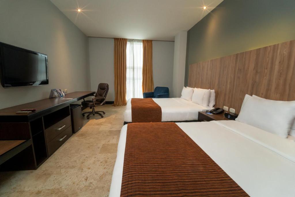 TV a/nebo společenská místnost v ubytování GHL Hotel Barranquilla