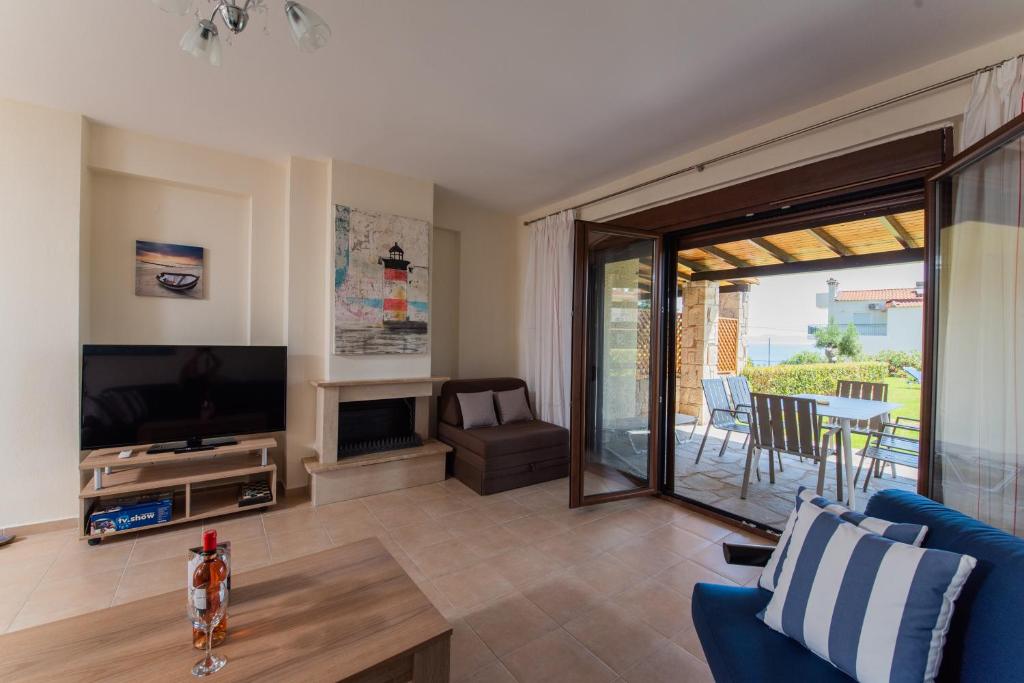 A television and/or entertainment centre at Ariadni -Villas- luxury houses