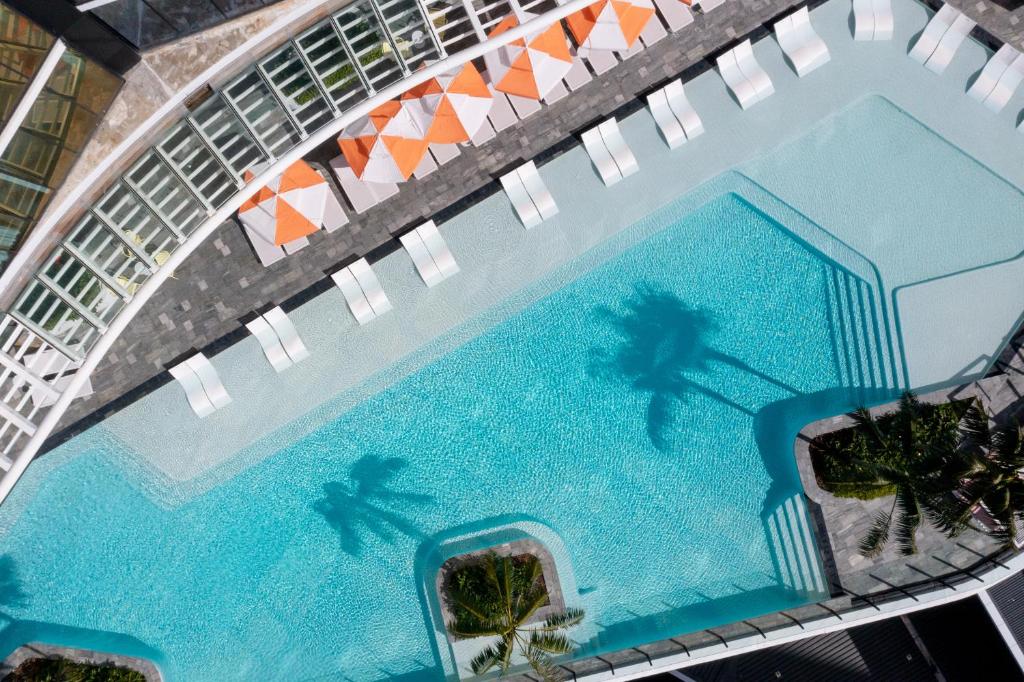 an overhead view of a large swimming pool at Dorsett Gold Coast in Gold Coast