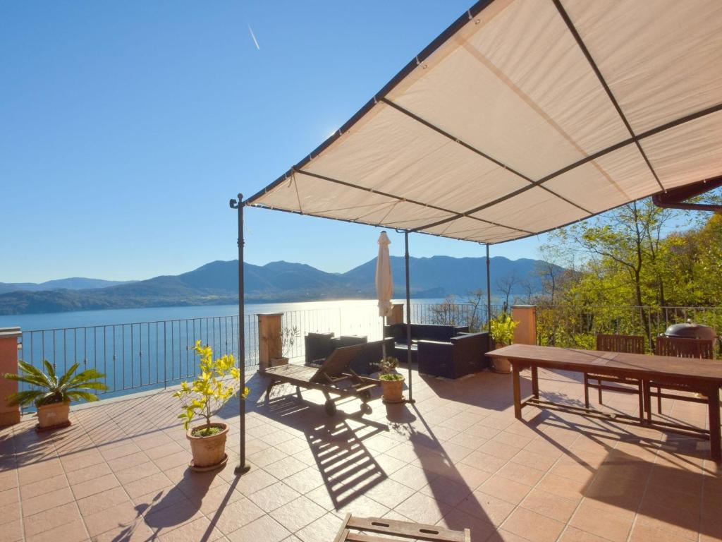 a patio with a view of the water at Belvilla by OYO Panoramica in Oggebbio