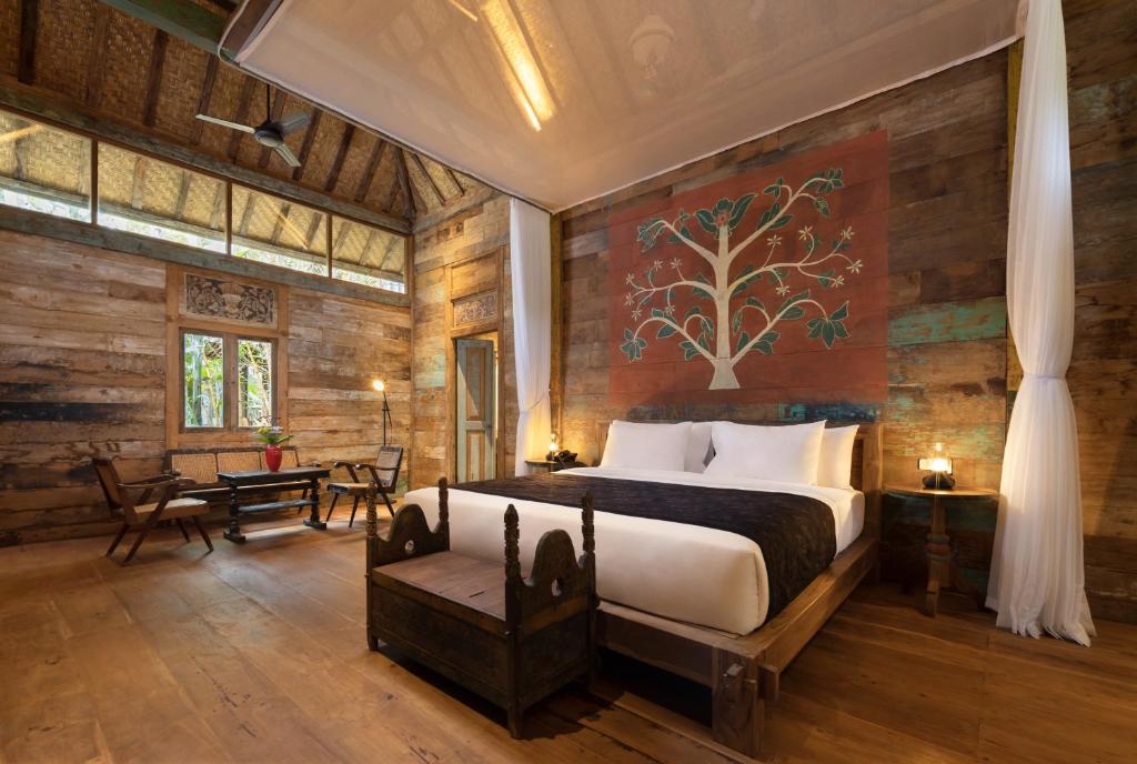 Postel nebo postele na pokoji v ubytování Korurua Dijiwa Ubud