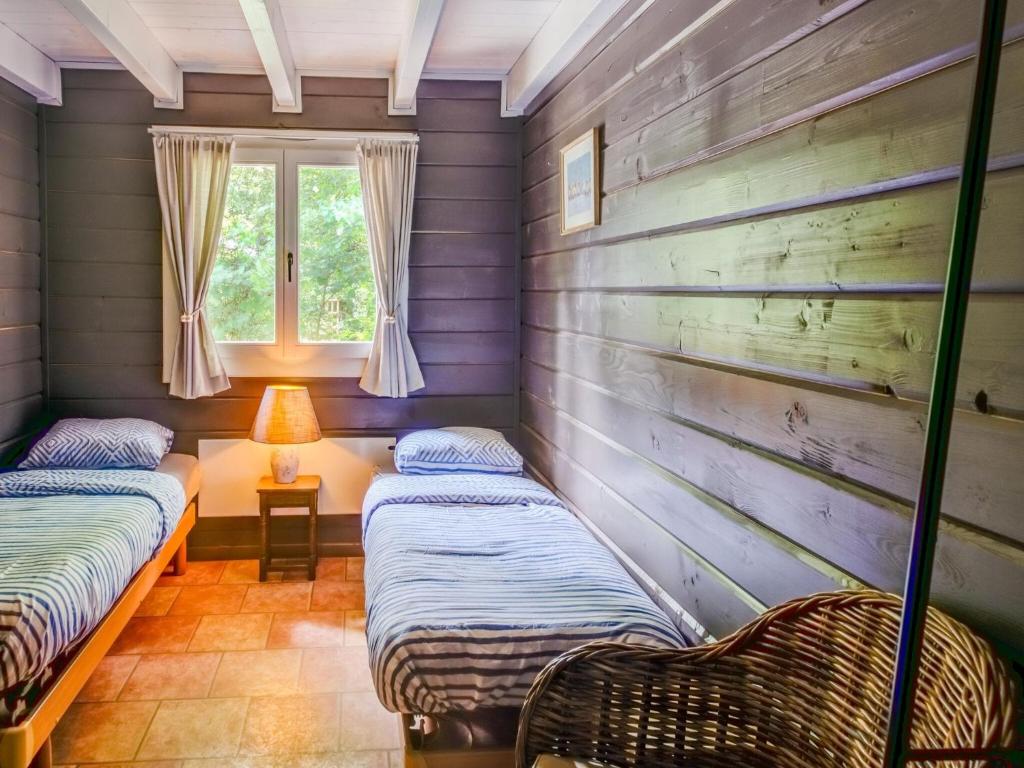 Postel nebo postele na pokoji v ubytování Chalet in Ardennes near Durbuy with Sauna