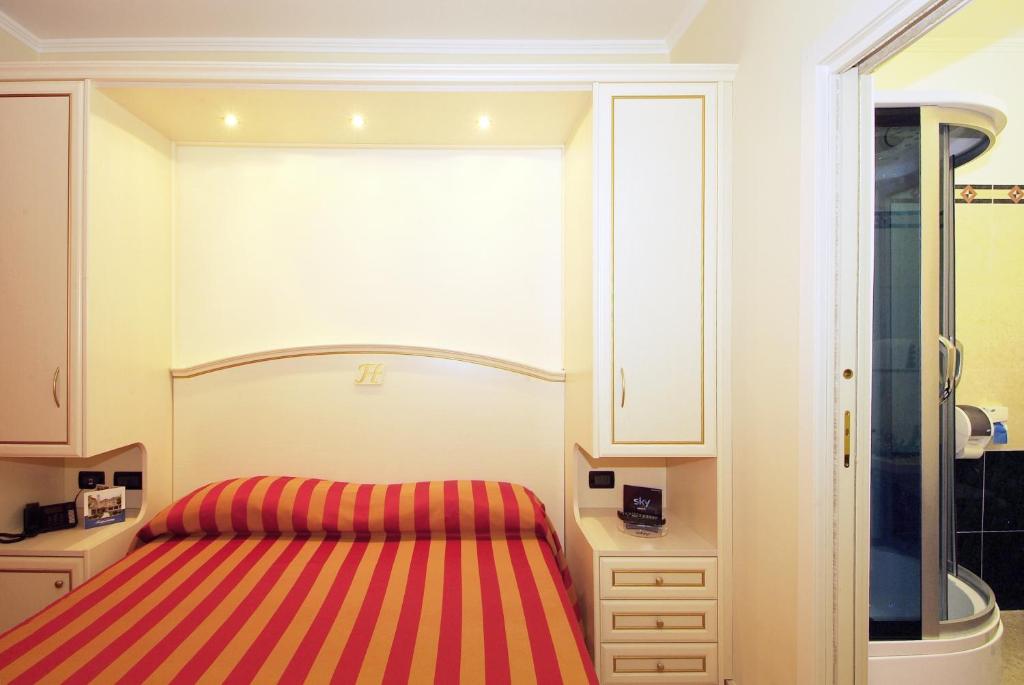 Postel nebo postele na pokoji v ubytování Fashion Hotel