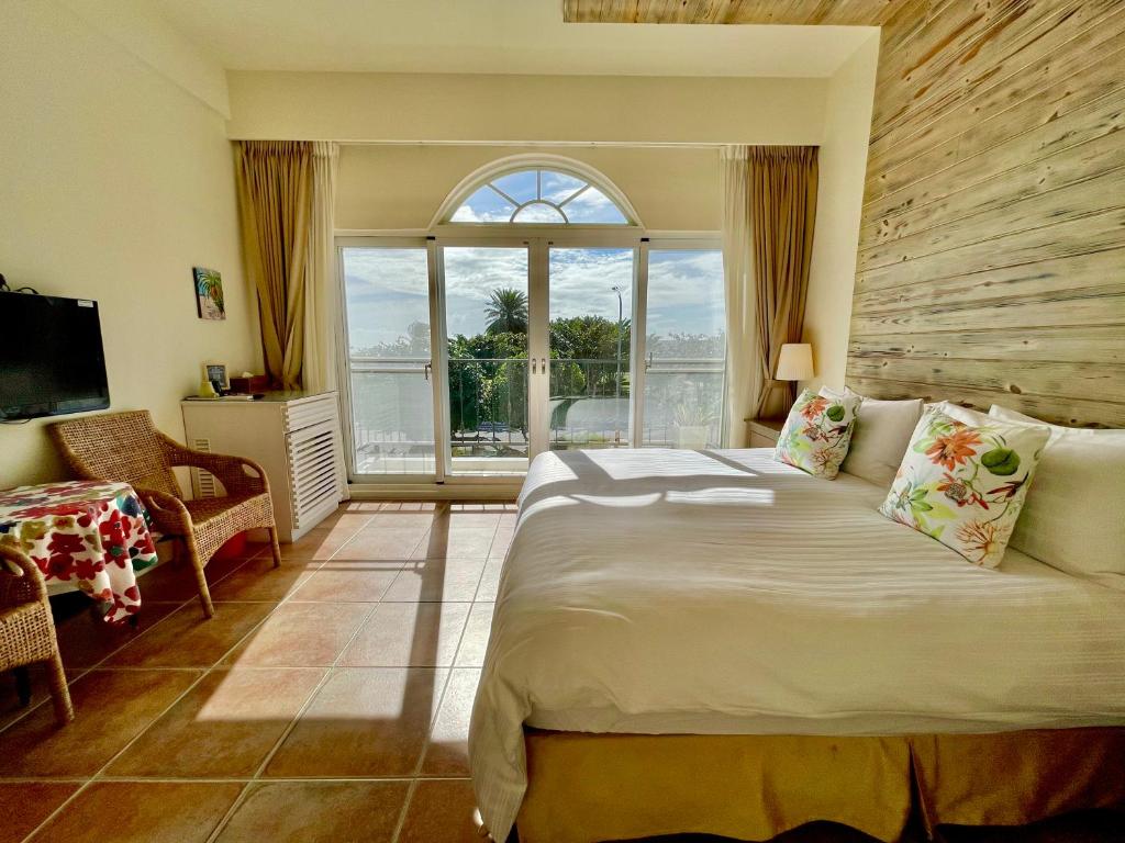 Postel nebo postele na pokoji v ubytování SpoonDrift Hostal Kenting