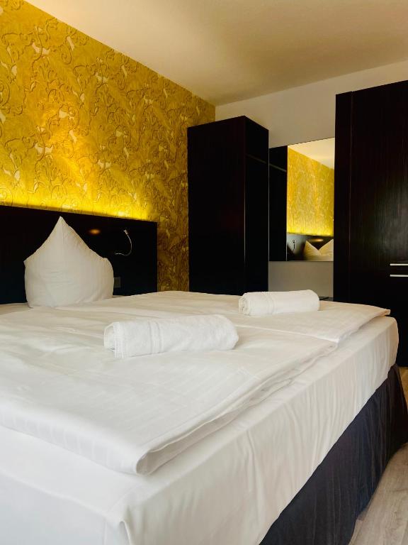 Postel nebo postele na pokoji v ubytování Hotel 22