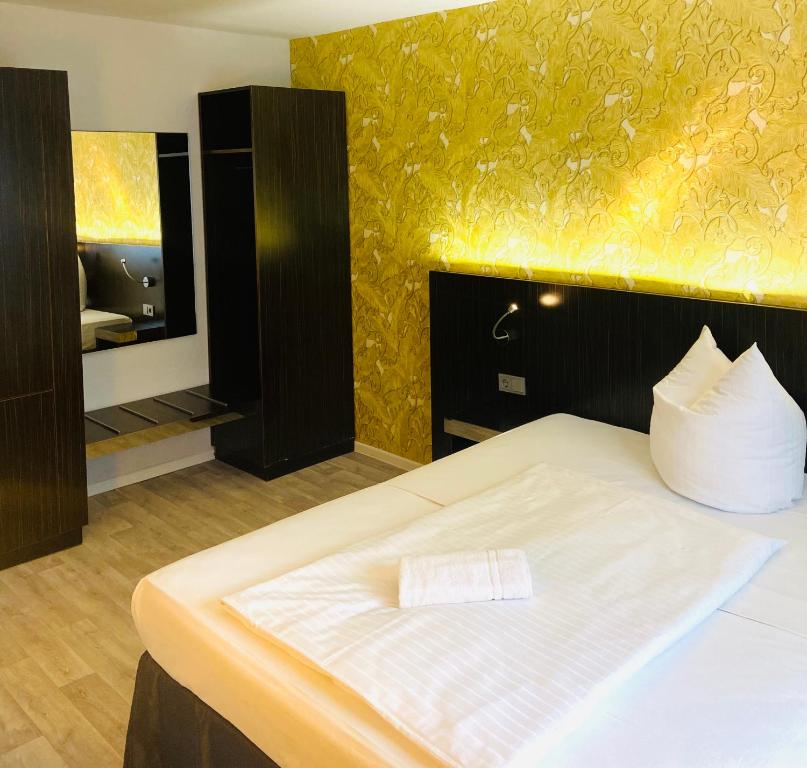 Postel nebo postele na pokoji v ubytování Hotel 22