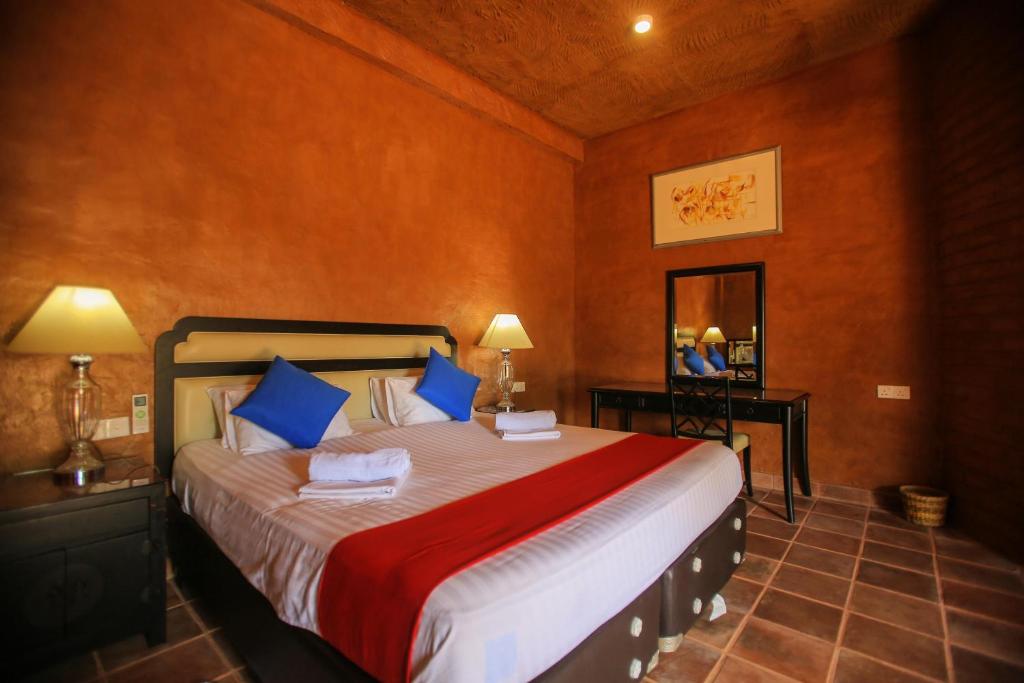 Postel nebo postele na pokoji v ubytování Jungle Hut Resort Sigiriya