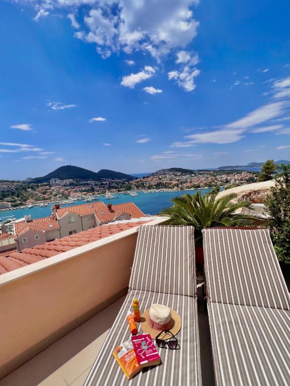 a childs toy sitting on a bench on a roof at Apartment Lana in Dubrovnik