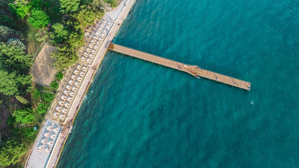 an aerial view of a pier in the water at Olive Family Suites - Hotel & Resort Adria Ankaran in Ankaran