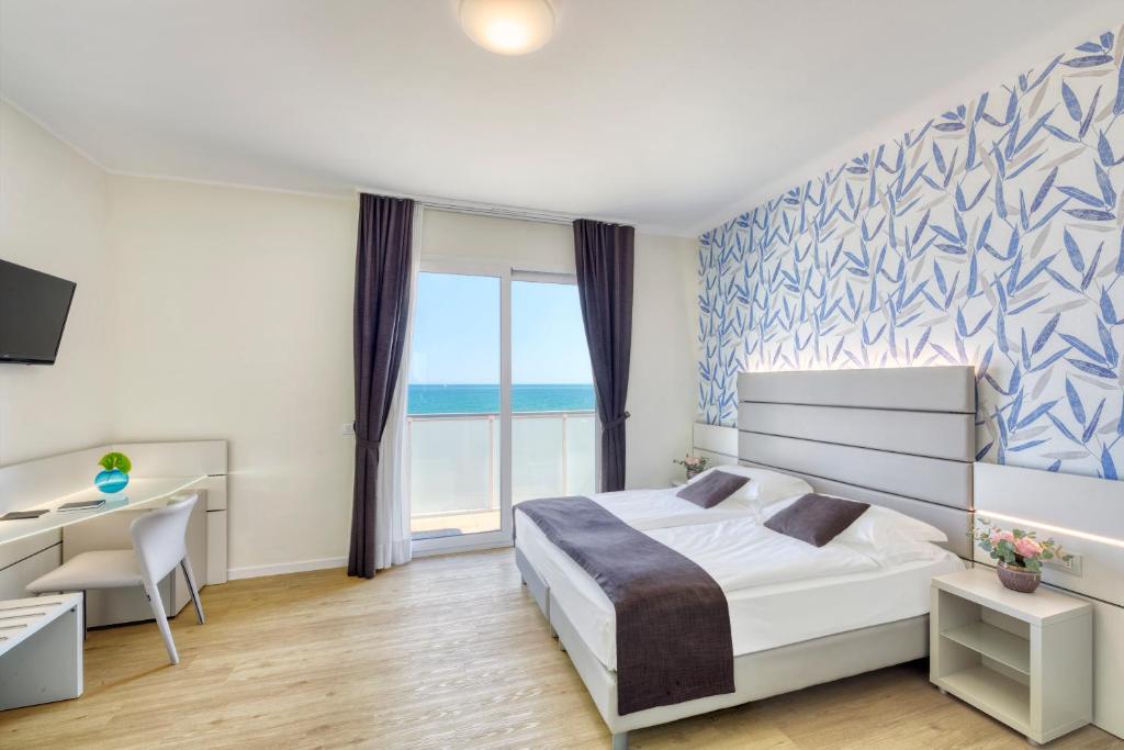 Postel nebo postele na pokoji v ubytování Hotel Astoria