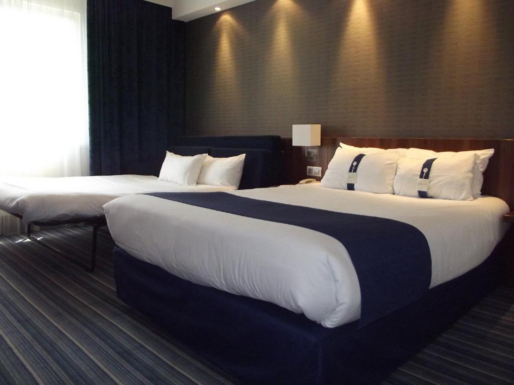 Postel nebo postele na pokoji v ubytování Holiday Inn Express Strasbourg - Sud by IHG