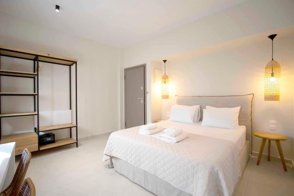 A bed or beds in a room at Palm Residences