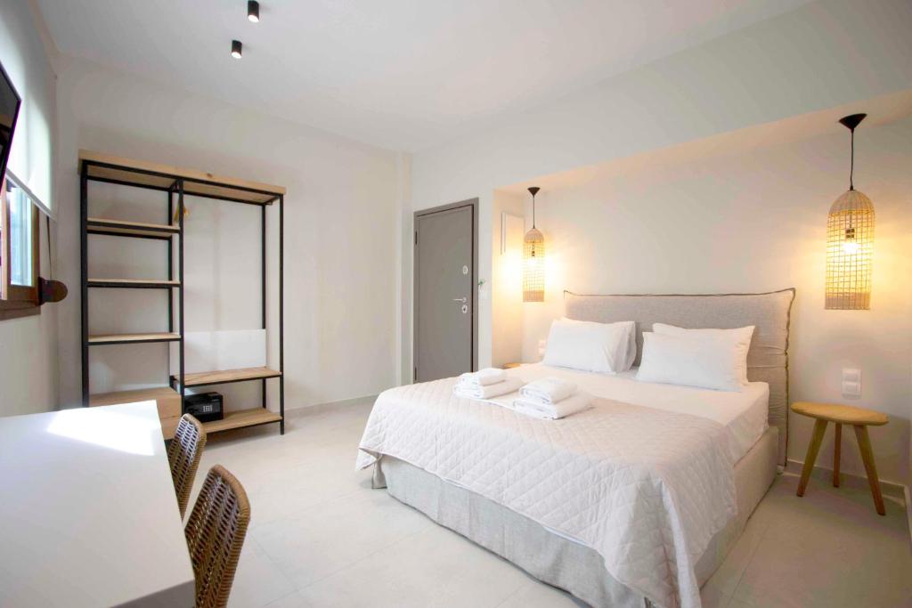 A bed or beds in a room at Palm Residences