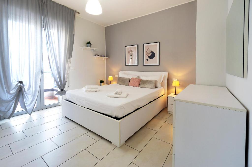 A bed or beds in a room at GetTheKey Pasubio Apartment