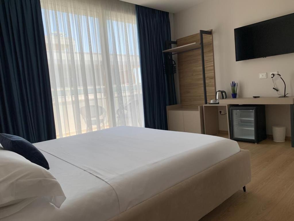 Postel nebo postele na pokoji v ubytování Grand Mirage