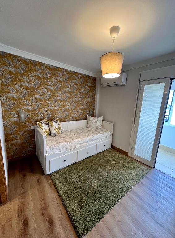 Posteľ alebo postele v izbe v ubytovaní Apartamentos Prestige Suites Málaga II
